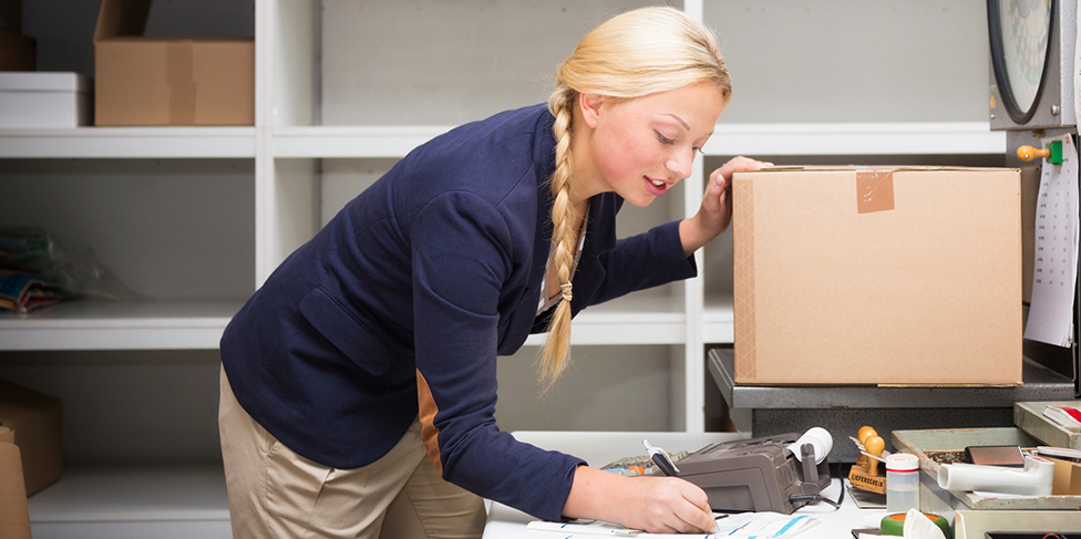 Woman shipping box.