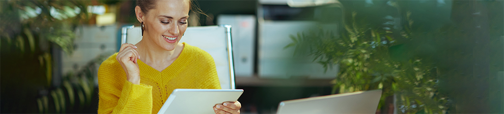Woman looking at a tablet.