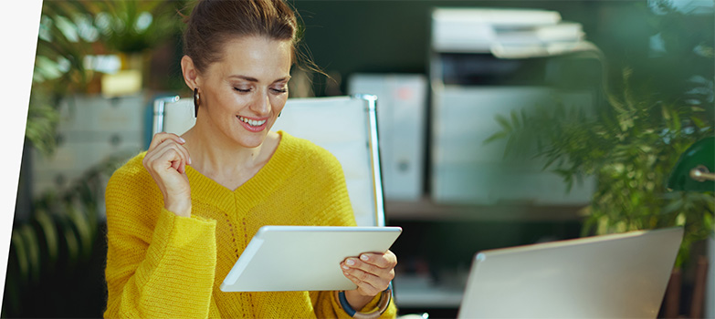 Woman looking at a tablet.