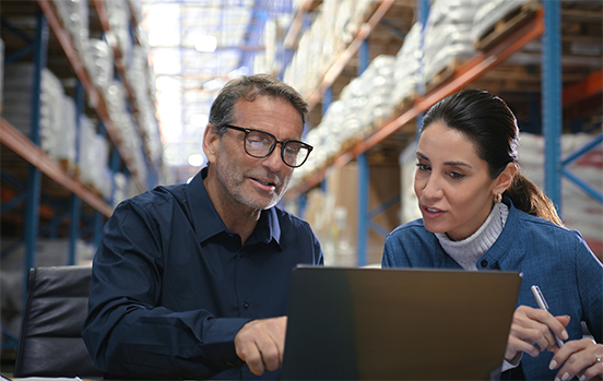 Customer taping a box to prepare for shipping.
