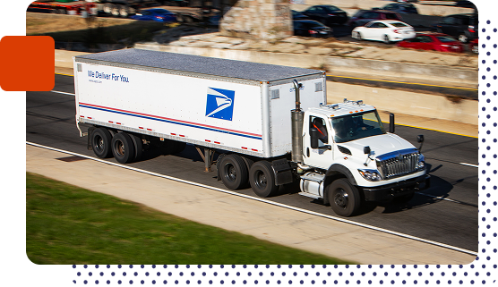 A postal truck on a highway with a trailer.
