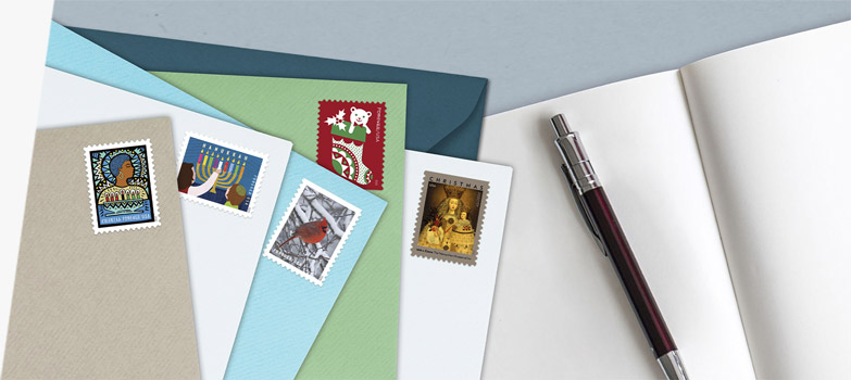 Envelopes with First-Class Mail Forever® holiday stamps for Kwanzaa, Hanukkah, Christmas, and more.