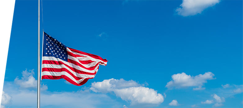 Image of the American flag waving in the wind.