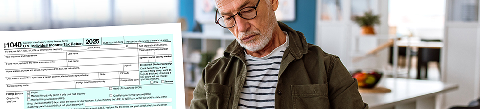 2025 1040 tax return form in the foreground with a man filling out paperwork in the background.
