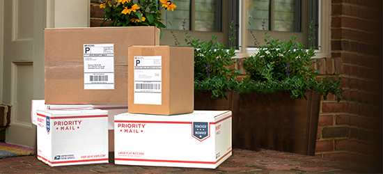 Stacked mailable boxes awaiting pickup.