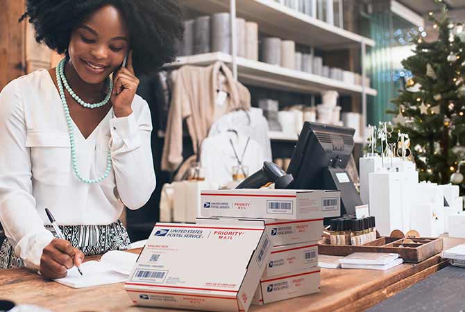 Small business owner preparing to ship with USPS.
