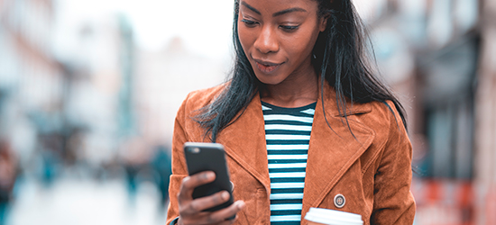 Image of a person checking their smartphone.