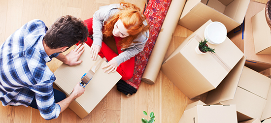Image of two people packing packages.