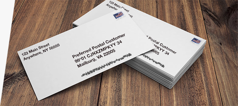A stack of USPS Informed Address business mail.