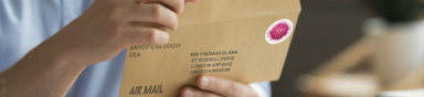 Person taping a box shut.