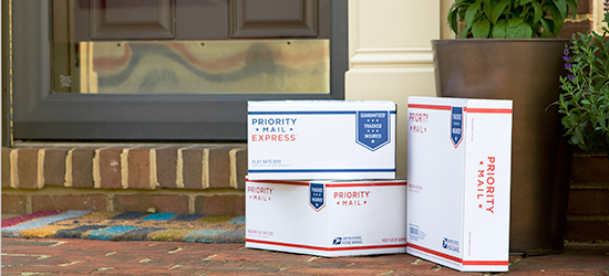 Boxes outside a residence for USPS package pickup.