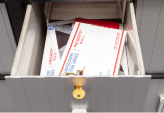 Large PO Box, Size 4, with small and medium-sized packages and other mail.