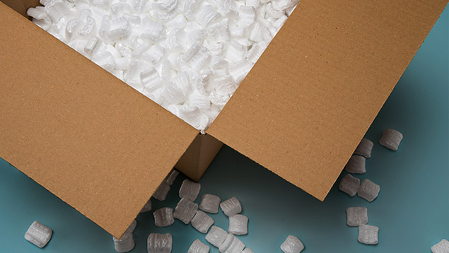 Image of a shipping box with styrofoam pellets inside.