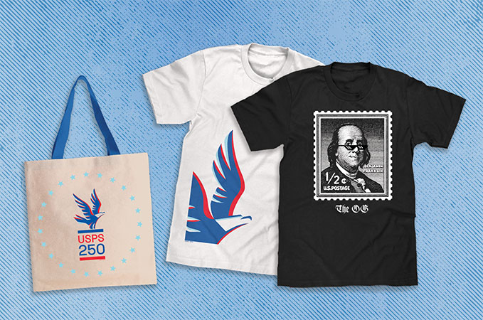 A canvas tote with a print of an eagle in flight and the words "USPS 250" in a circle of stars, a white T-shirt with a print of an eagle in flight in the lower left corner and a white hat with a print of an eagle in flight and the words "USPS 250" in a circle of stars.