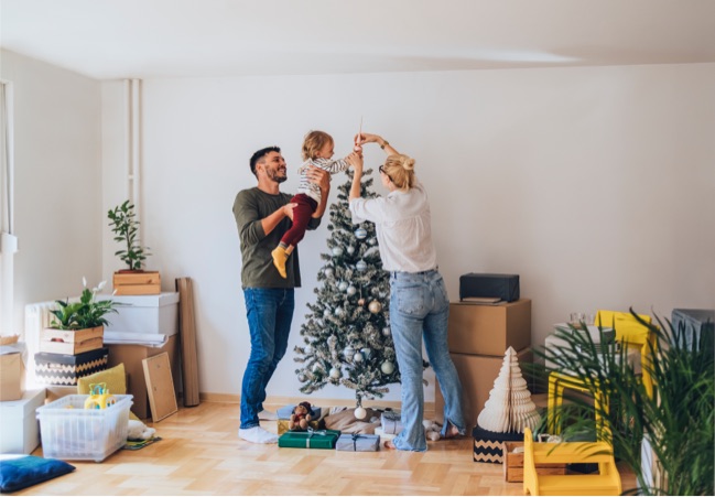A family decorating their Christmas tree.
