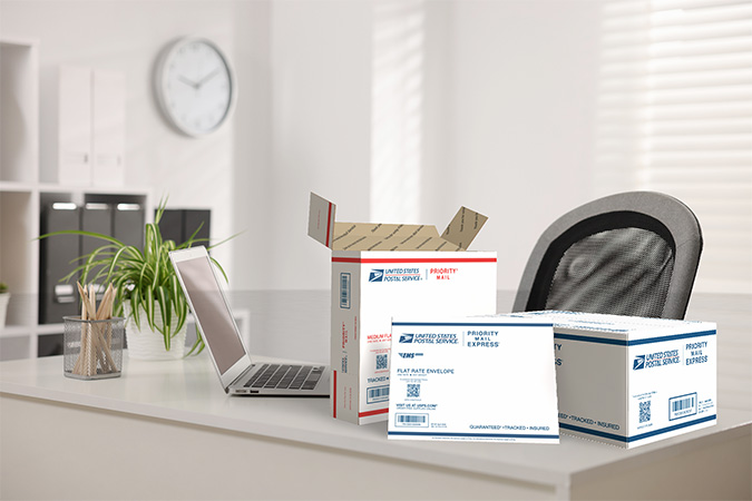 Priority Mail and Priority Mail Express supplies sitting on a desk.