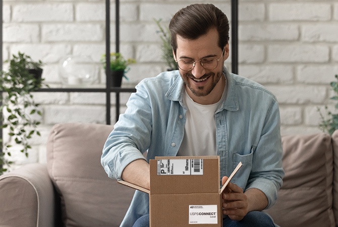 Person opening a package shipped via USPS Connect Local.