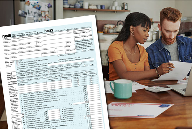 Un formulario 1040 del IRS en primer plano mientras dos personas completan formularios de impuestos en una mesa al fondo.