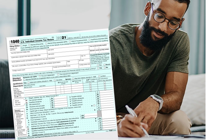 Image of 1040 form and a person in the filling out paperwork.