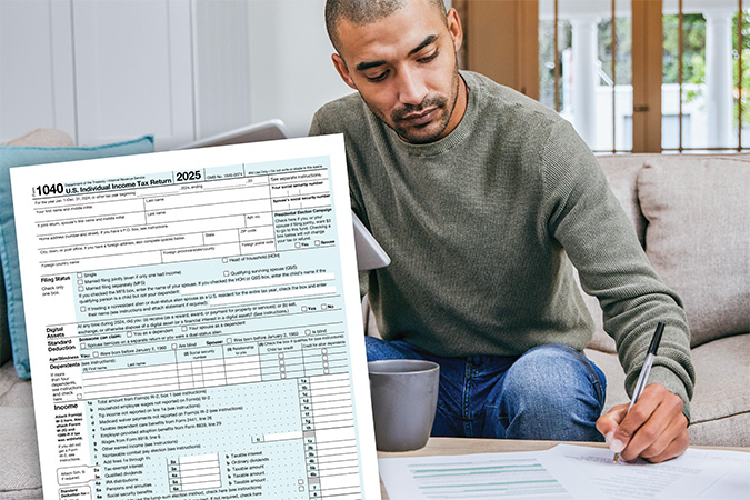 An IRS form 1040 on a desk being filled out.