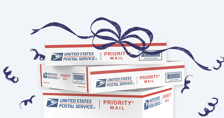 Stacked mailing boxes with a festive bow appearing on top.