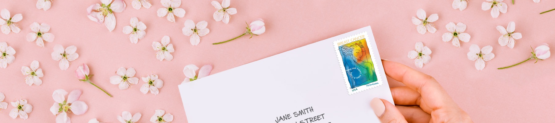 Breast Cancer Research semipostal stamp on a white envelope.