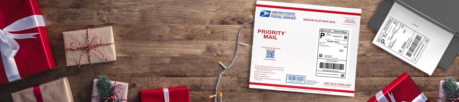 USPS Priority Mail Flat Rate boxes and an envelope with a Forever Stamp sitting on a table.