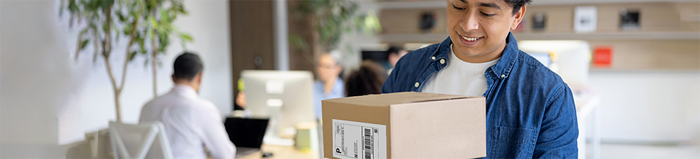 Man preparing to ship packages.