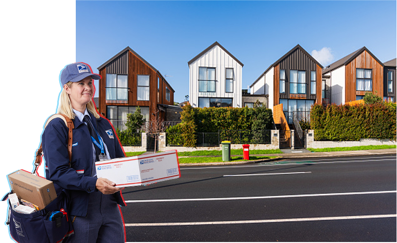 A street of houses with a mailperson carrying packages.