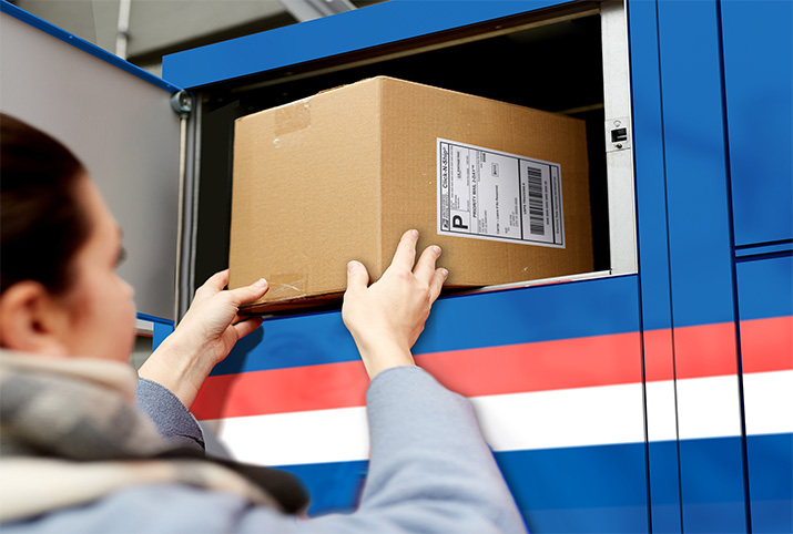 A person reaching out to a package in a Smart Locker.