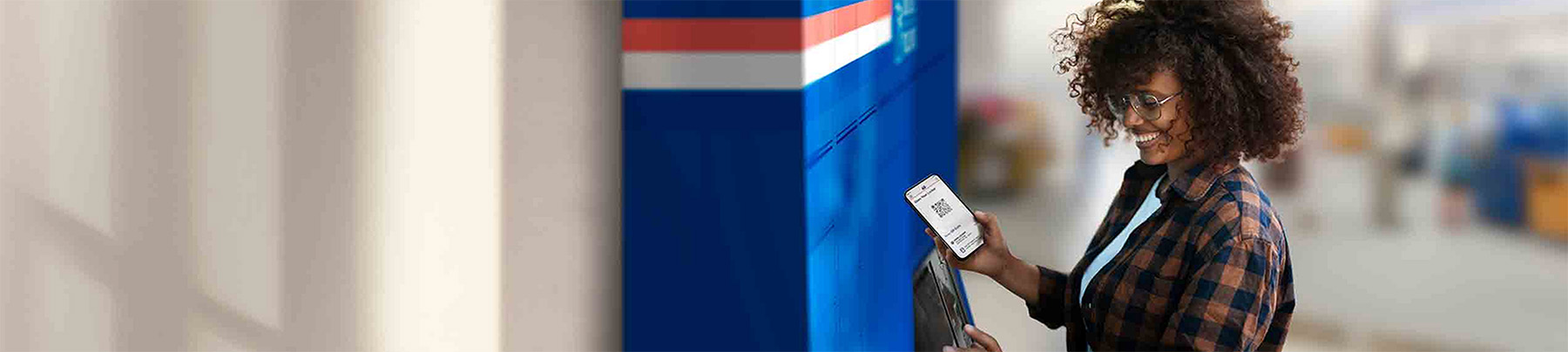 A person retrieving a packkage from a Smart Locker.