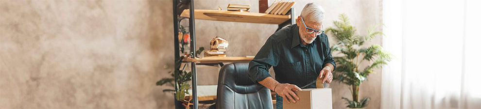 A person preparing a package to be shipped to a smart locker.